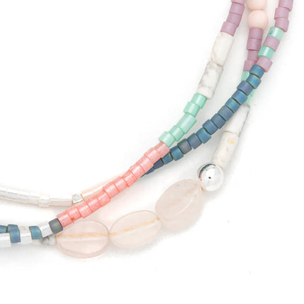 Multicolored beaded necklace on a white background