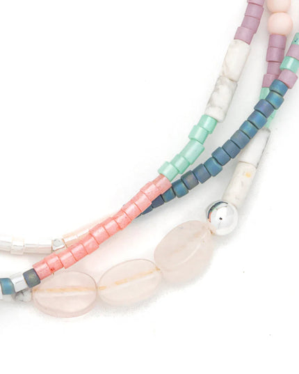 Multicolored beaded necklace on a white background