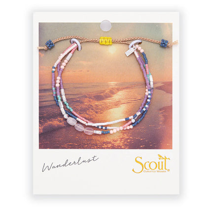 Multistrand beaded bracelet on Scout branded card with sunset beach background