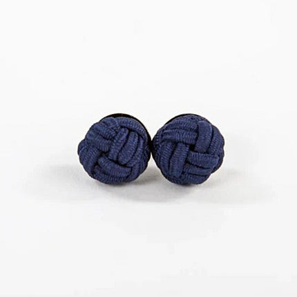 Pair of navy blue knot earrings on a white background