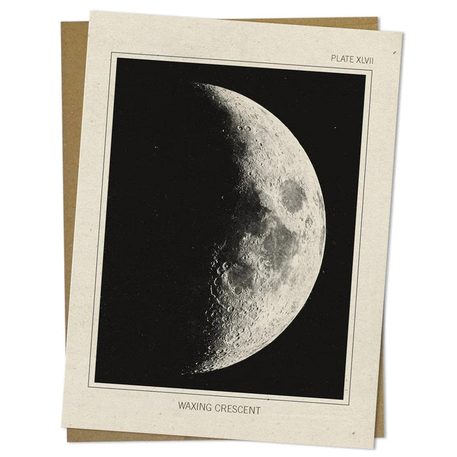 a close up look of the details of an off white greeting card with a vintage image of the moon in its waxing crescent phase