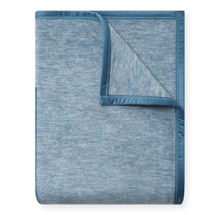 Blue textured blanket on a white background