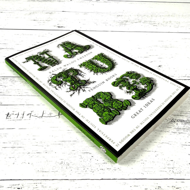 Book titled 'Nature' with green text on a white wooden surface