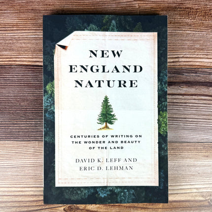 the book "New England Nature" lying against a rustic wood background