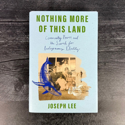 Book titled 'Nothing More of This Land' by Joseph Lee on a wooden surface