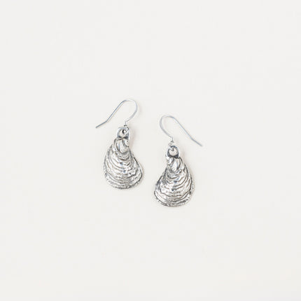 a pair of pewter oyster shell shaped earrings on a white background