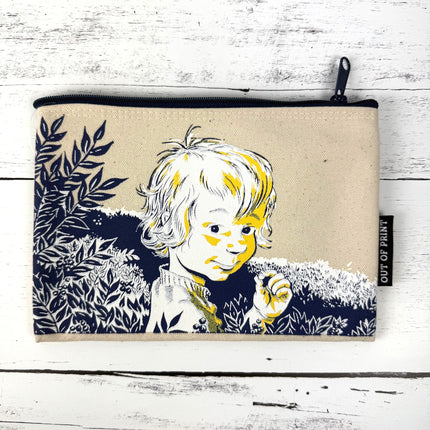 Canvas pouch with a printed design of a child and nature on a white wooden surface