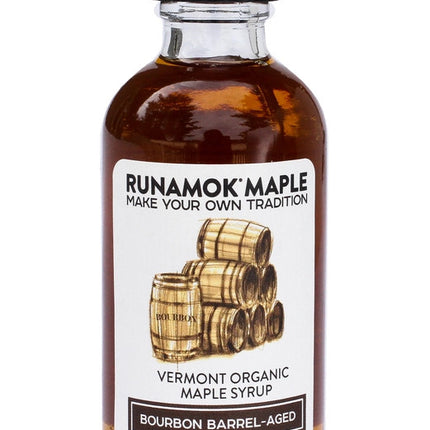 a bottle of the bourbon barrel aged maple syrup from the pantry favorites collection against a white background