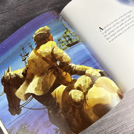 Paul Revere's Ride open to page with Illustration of a person on horseback with a ship in the background