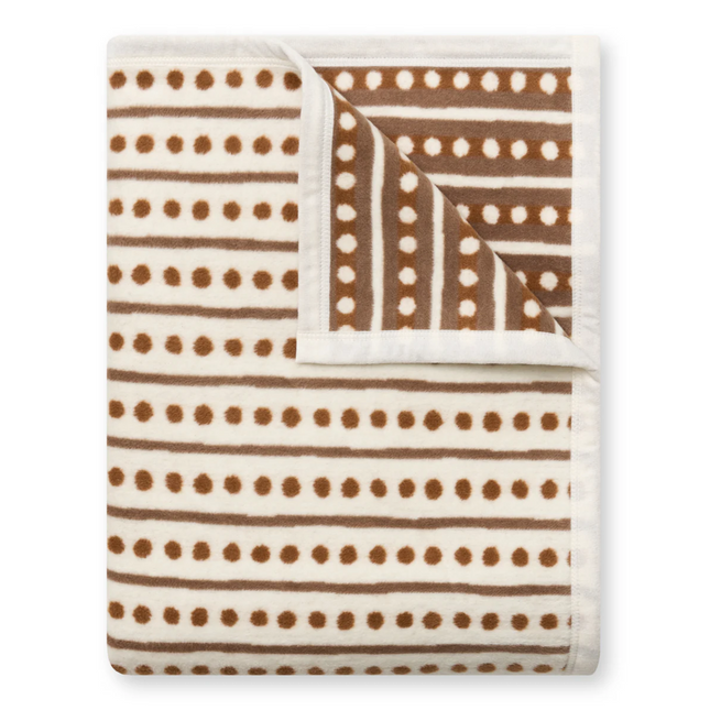 Blanket with brown polka dot and stripe pattern on a white background