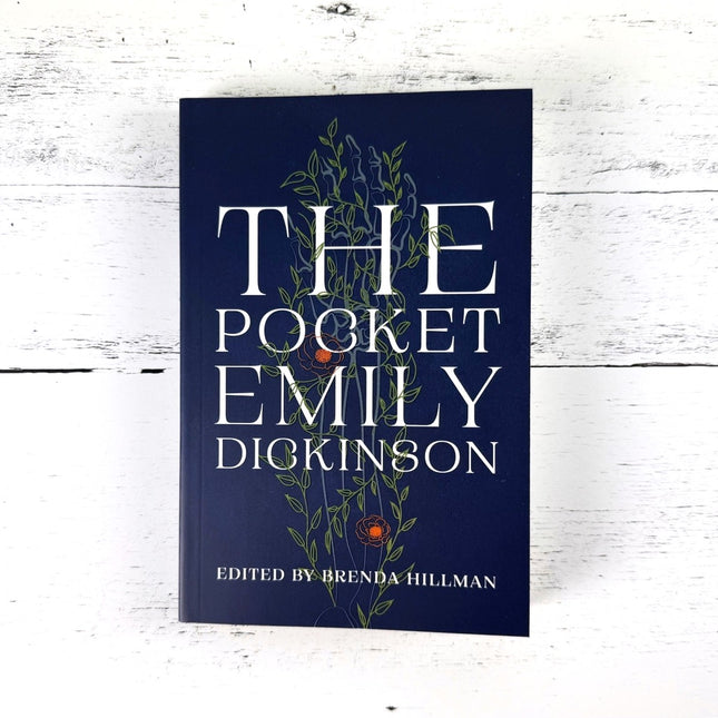 Book titled 'The Pocket Emily Dickinson' on a white wooden surface
