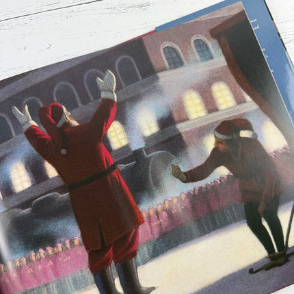 Interior page of the Polar Express showing illustration of Santa surrounded by elves