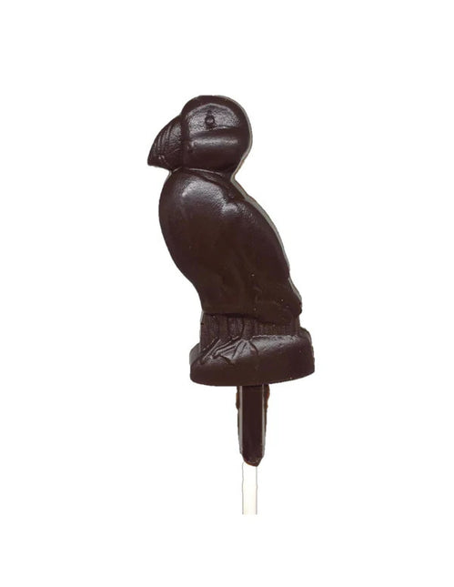 a dark chocolate pop, crafted in the charming shape of a puffin against a white background