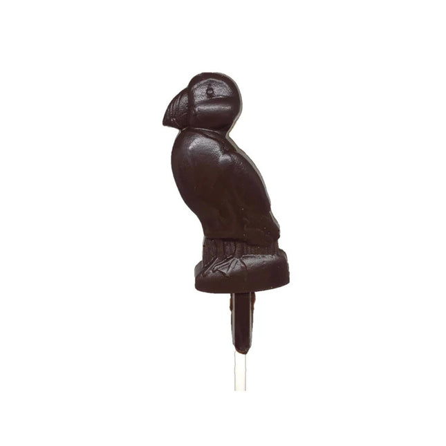 a dark chocolate pop, crafted in the charming shape of a puffin against a white background
