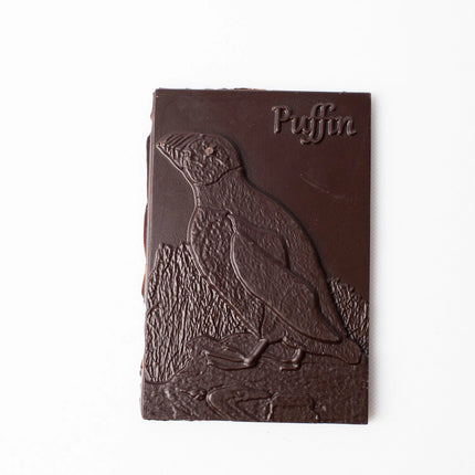 Chocolate bar with a penguin design and 'Puffin' branding on a white background