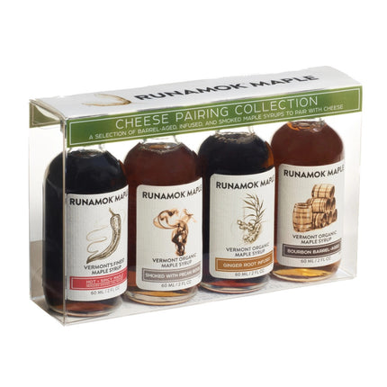 a clear gift package of 4 small bottles of maple syrup that pair well with cheese
