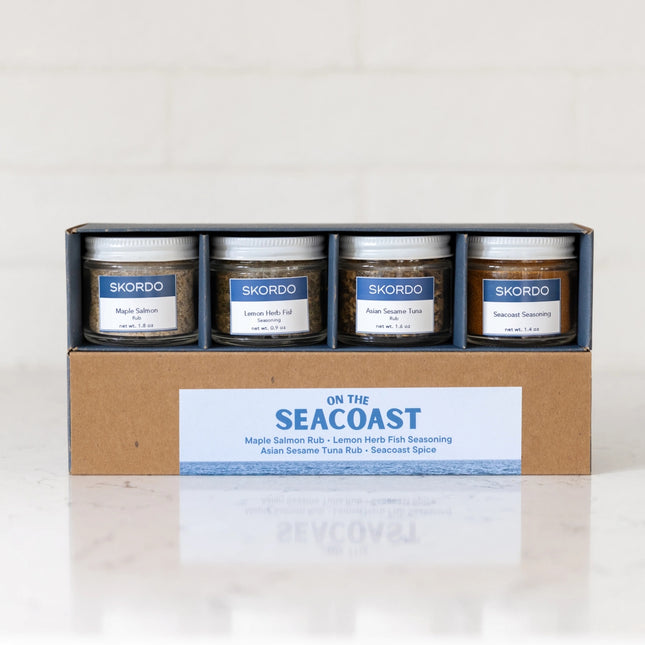 Set of Skordo seasoning jars in a cardboard box on a white background