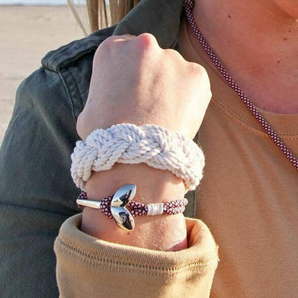 original sailor bracelet on a wrist alongside another nautical bracelet with an anchor