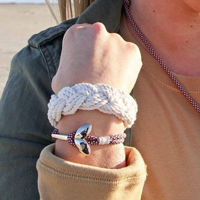 original sailor bracelet on a wrist alongside another nautical bracelet with an anchor