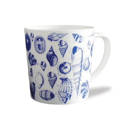 White mug with blue shell pattern on a white background