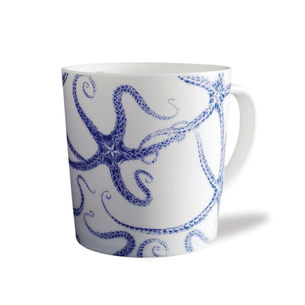 White mug with blue starfish design on a white background