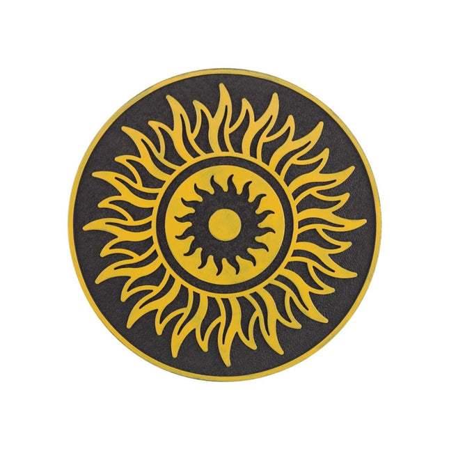 A circular black and yellow sun emblem with a textured background, isolated on a white backdrop.