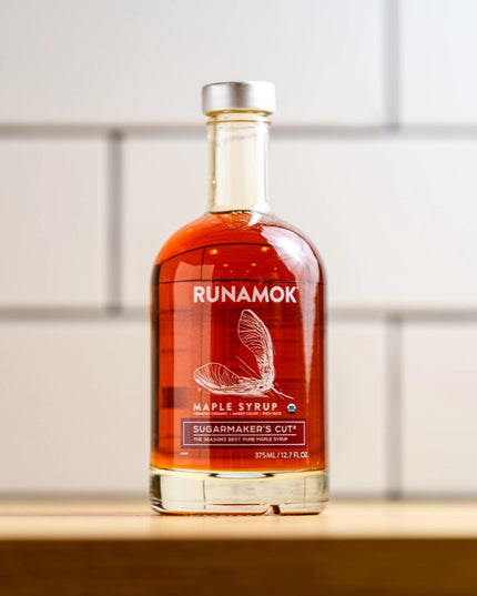 a bottle of Sugarmaker's Cut on a table with a white subway tile background