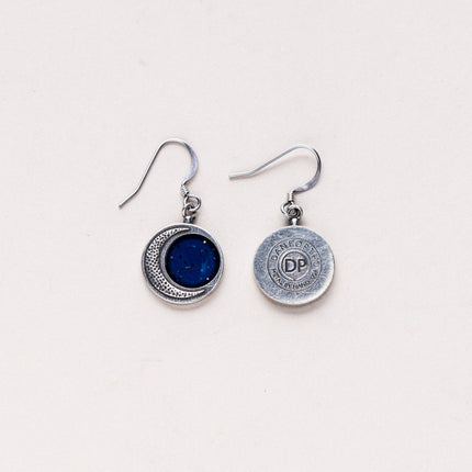 Back view of the Crescent Moon Earrings displaying the maker's mark stamped on the pewter, indicating the handcrafted quality of the piece.