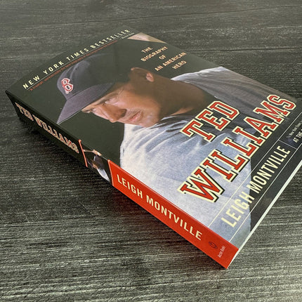 Book titled 'Ted Williams' by Leigh Montville on a wooden surface