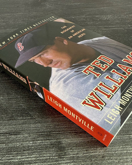 Book titled 'Ted Williams' by Leigh Montville on a wooden surface