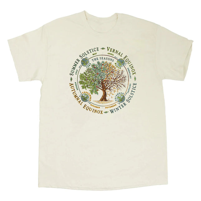 an off white tee shirt with illustration of a tree throughout each of the four seasons. text surrounds the circular design noting the Vernal Equinox, Summer Solstice, Autumnal Equinox, and Winter Solstice