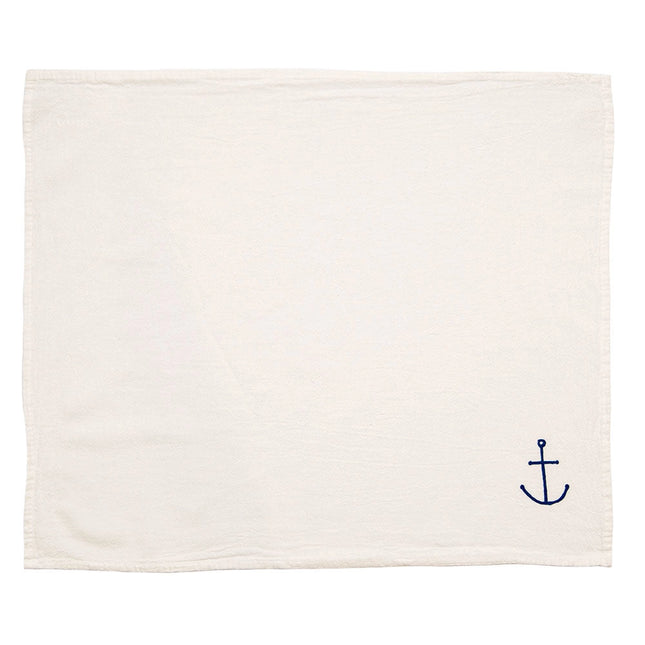unfolded napkin with a small hand drawn anchor design in blue in the bottom right corner