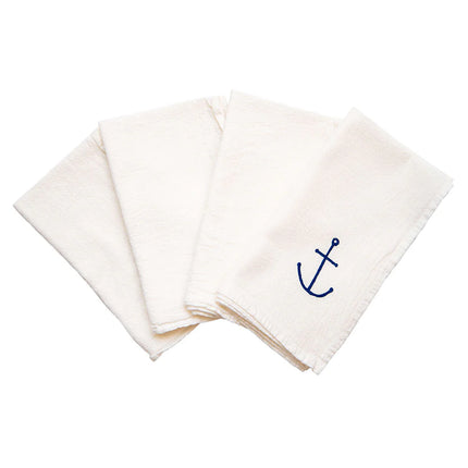 set of four white napkins fanned with the hand drawn blue anchor design showing on the top napkin