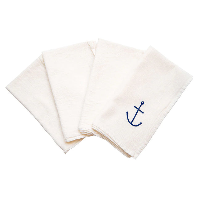 set of four white napkins fanned with the hand drawn blue anchor design showing on the top napkin