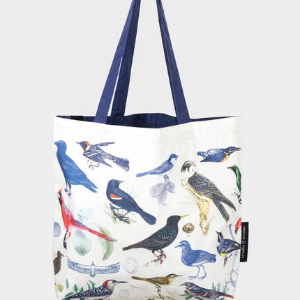 side 2 of the feathered friends tote featuring a range of birds in an academic illustration style on a white tote