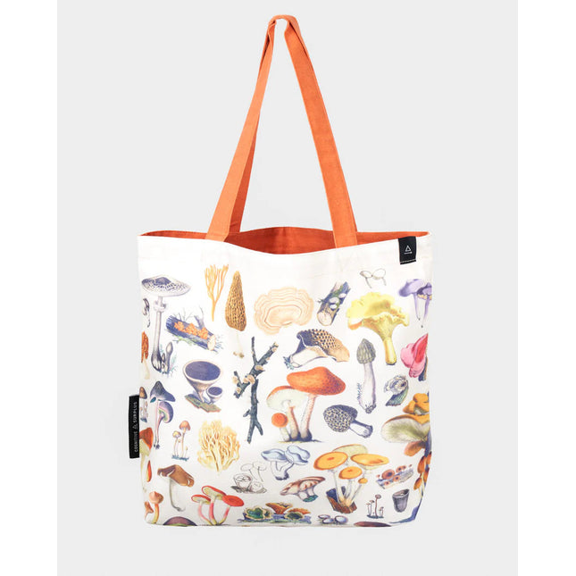 side one of the woodland mushrooms tote; a white tote bag with orange straps covered in vintage illustrations of woodland mushrooms
