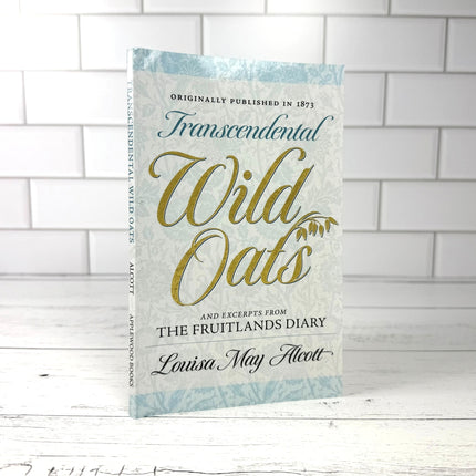 Book titled 'Transcendental Wild Oats' on a white tiled wall background