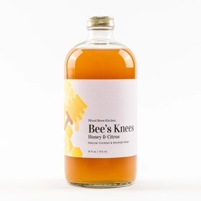 Bee's Knees Mixer bottle featuring a citrus-honey blend for cocktails and beverages. Made in the USA, shelf-stable, with ingredients including honey and lemon juice
