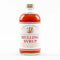 8oz mulling syrup bottle showing the warm colored amber liquid inside