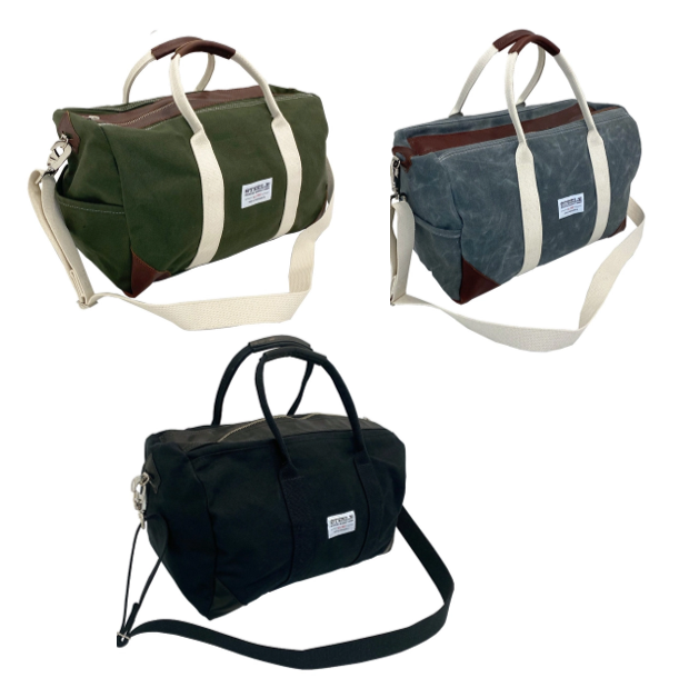 a trio of canvas weekender bags in 3 colorways: olive green, gray, and black