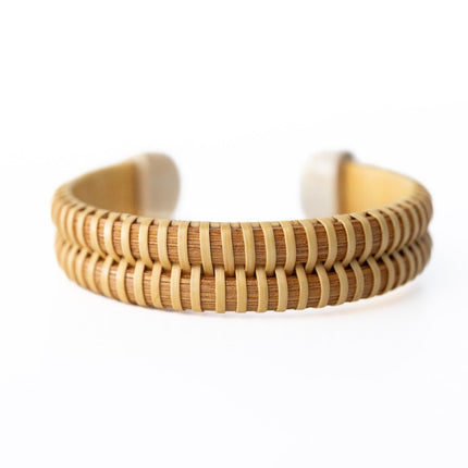 Woven Wooden bracelet with a wavy pattern on a white background