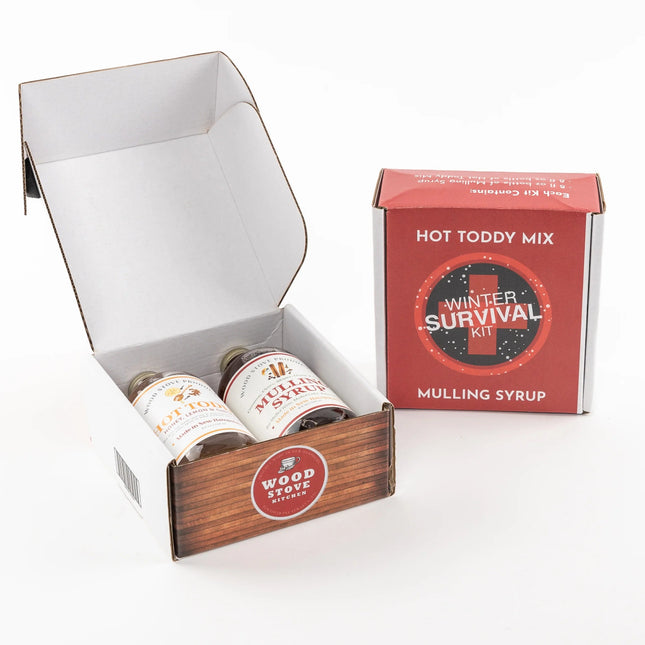 Hot Toddy Mix Winter Survival Kit with syrups and packaging on a white background