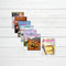 A fan arrangement of five Yankee Travel magazine issues on a white wood background, with a sixth magazine cover titled 'In Season' placed to the right.