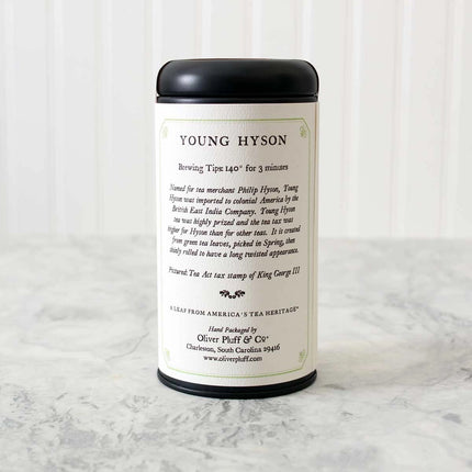 Tea canister with 'Young Hyson' branding on a marble surface