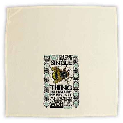 the unfolded bee tea towel showing the design at the bottom center of the towel to best display the design when folded