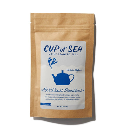 a kraft tea package with a white and blue label that reads "Cup of Sea - Maine Seaweed Teas - Bold Coast Breakfast" with a graphic of a solid blue tea kettle with seaweed shaped steam rising out of the spout