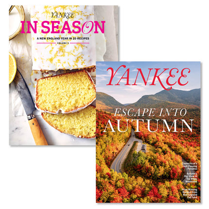 Two Yankee magazines shown on a white background: Yankee In Season Volume 5 with a sliced lemon cake, and Yankee Escape Into Autumn with a mountain road through colorful fall foliage.