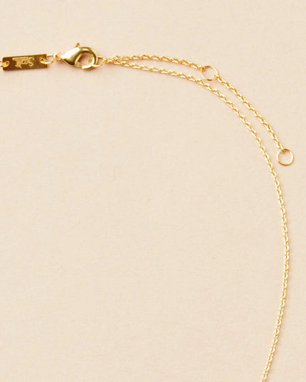 close up of the gold chain that goes with the gibbous slice gold necklace