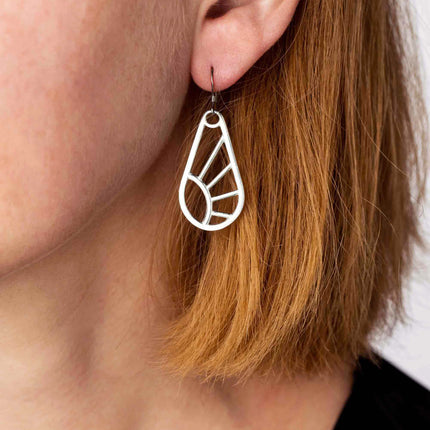 Shine Wire Earrings worn on a model, showcasing their delicate, geometric design and lightweight elegance, inspired by the sun’s rays