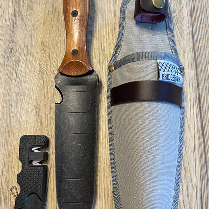 Essential Hori Hori knife shown side by side with its sheath and sharpener - side two of knife